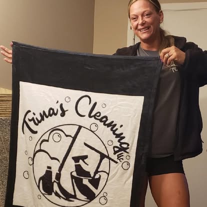 Trina with branded cleaning towel